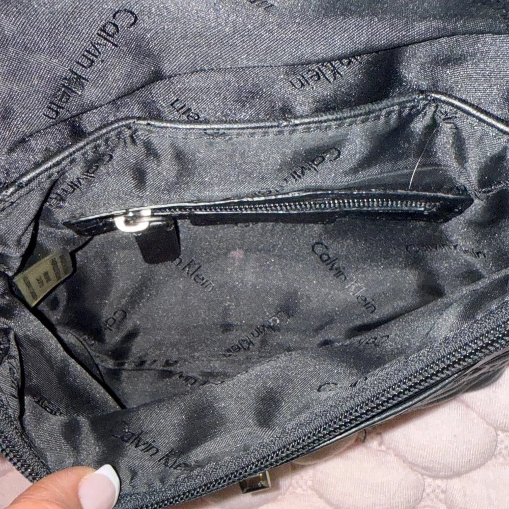 Calvin Klein Black Quilted Crossbody Bag with Silver Accents